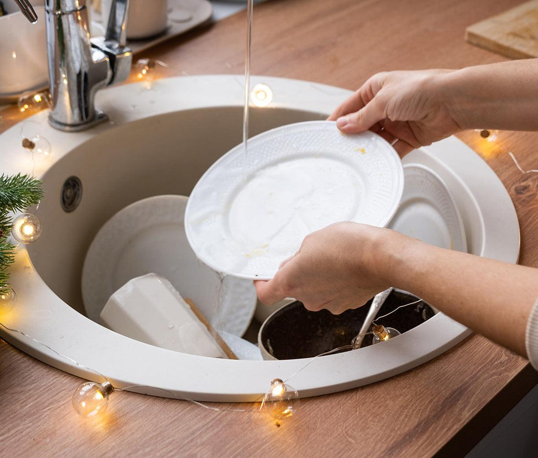 Washing dishes in a kitchen sink