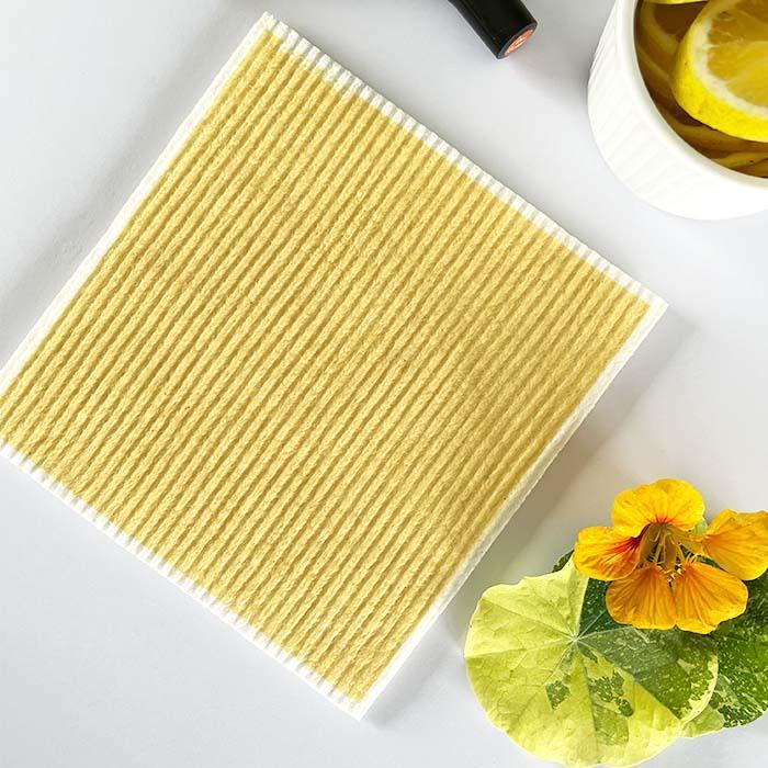 Lemon Four Good eco-friendly sponge cloth on kitchen bench, compostable material.